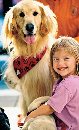 Young girl patient with Josh the golden retriever